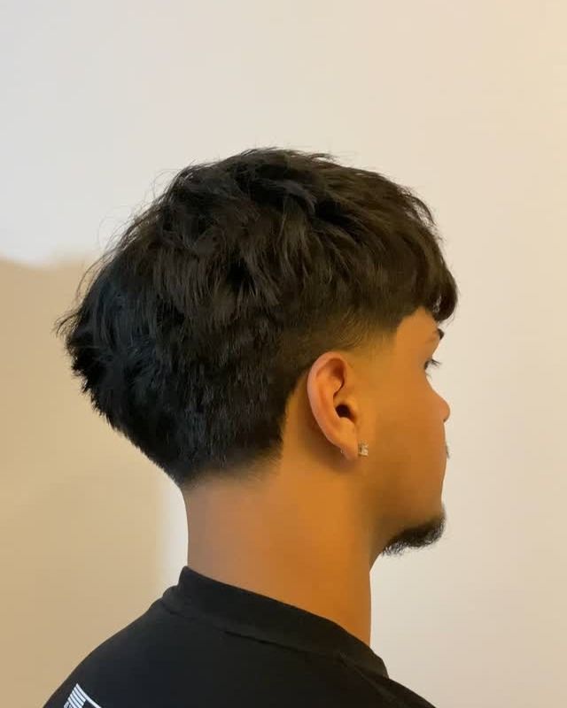 Side view of a blowout taper fade